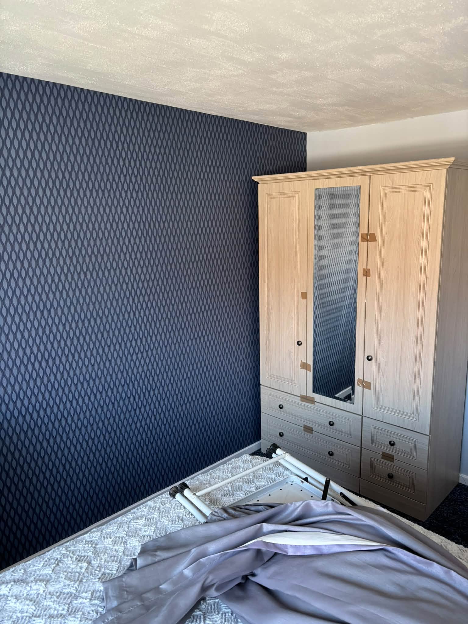 Bedroom feature wallpaper — project photograph