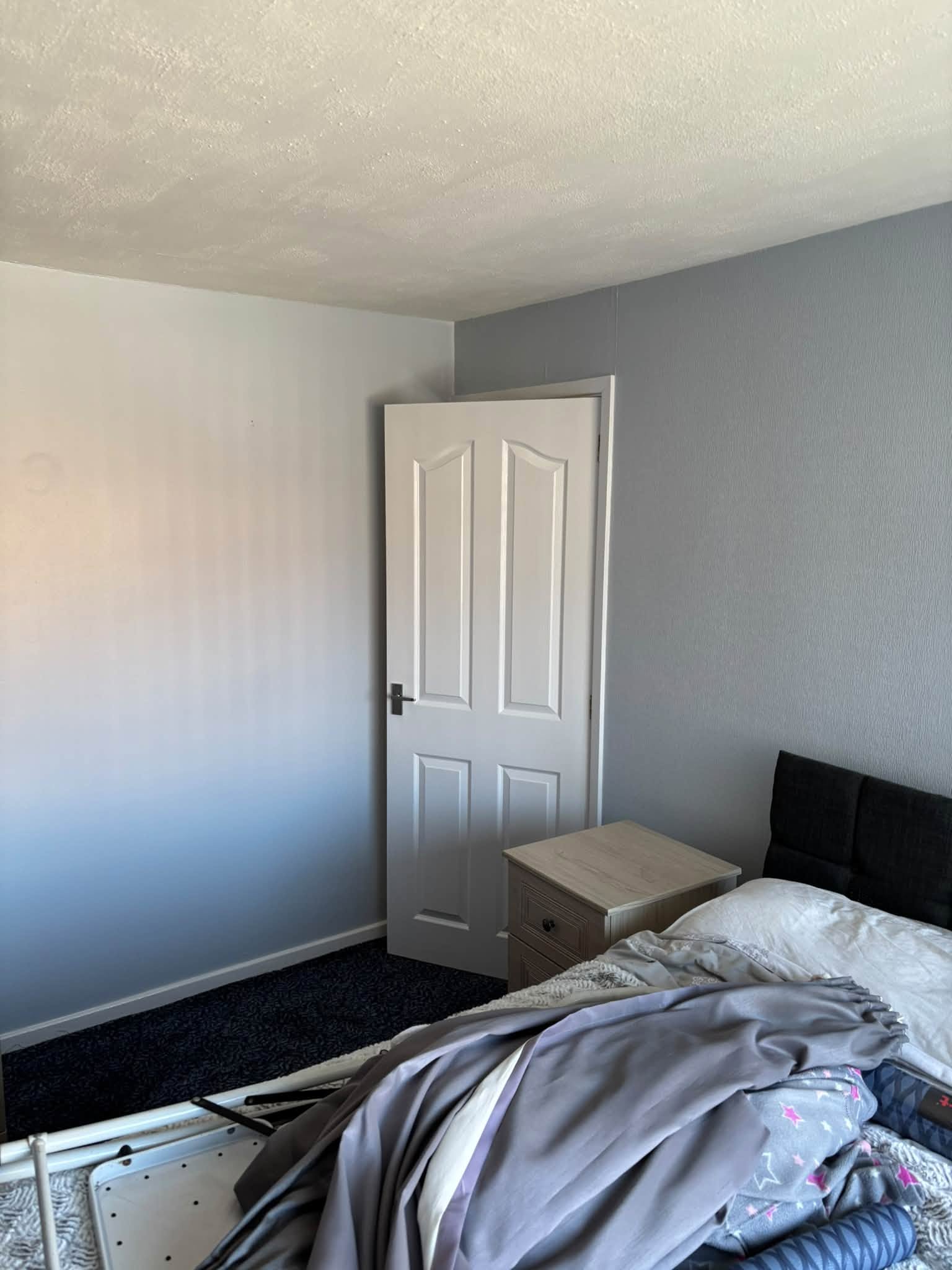 Bedroom feature wallpaper — project photograph