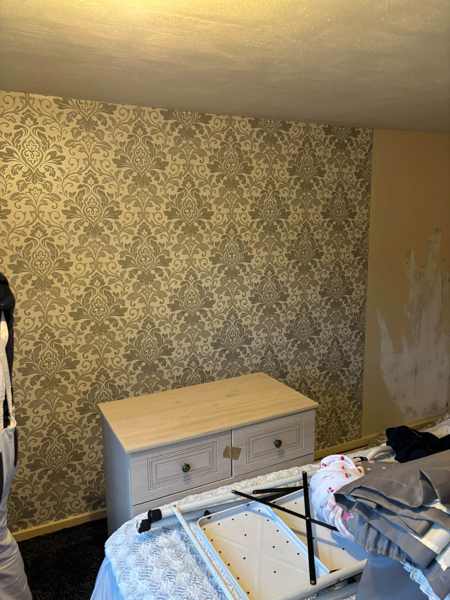 Bedroom feature wallpaper — project photograph