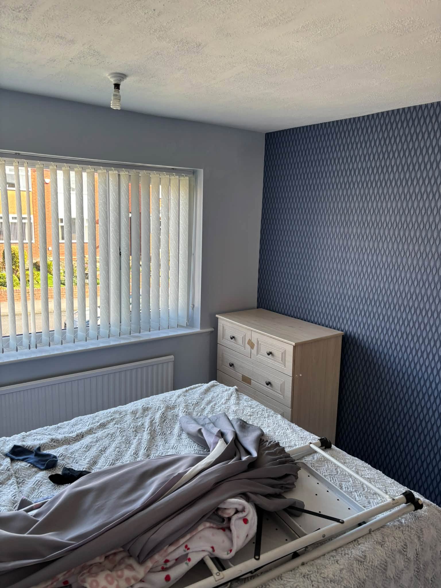 Bedroom feature wallpaper — project photograph